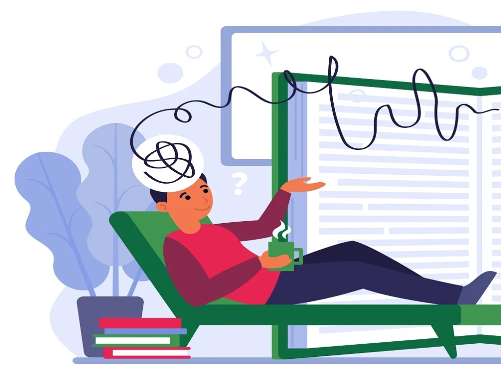 A person sitting with their head in their hands, overwhelmed by thoughts